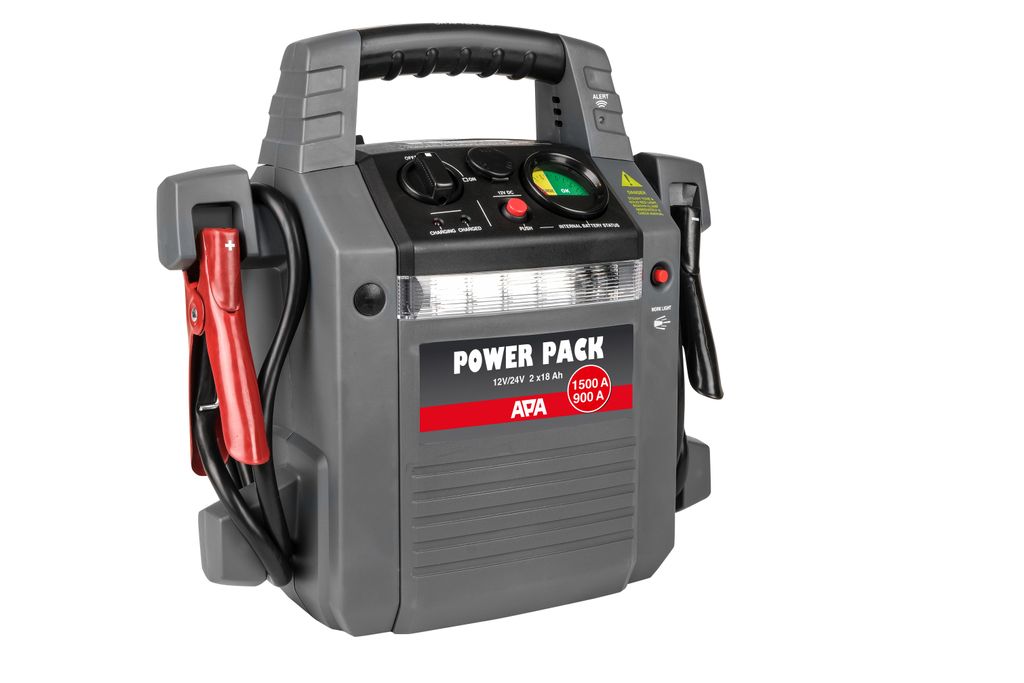 A gray portable power pack with red jumper cable clamps attached.