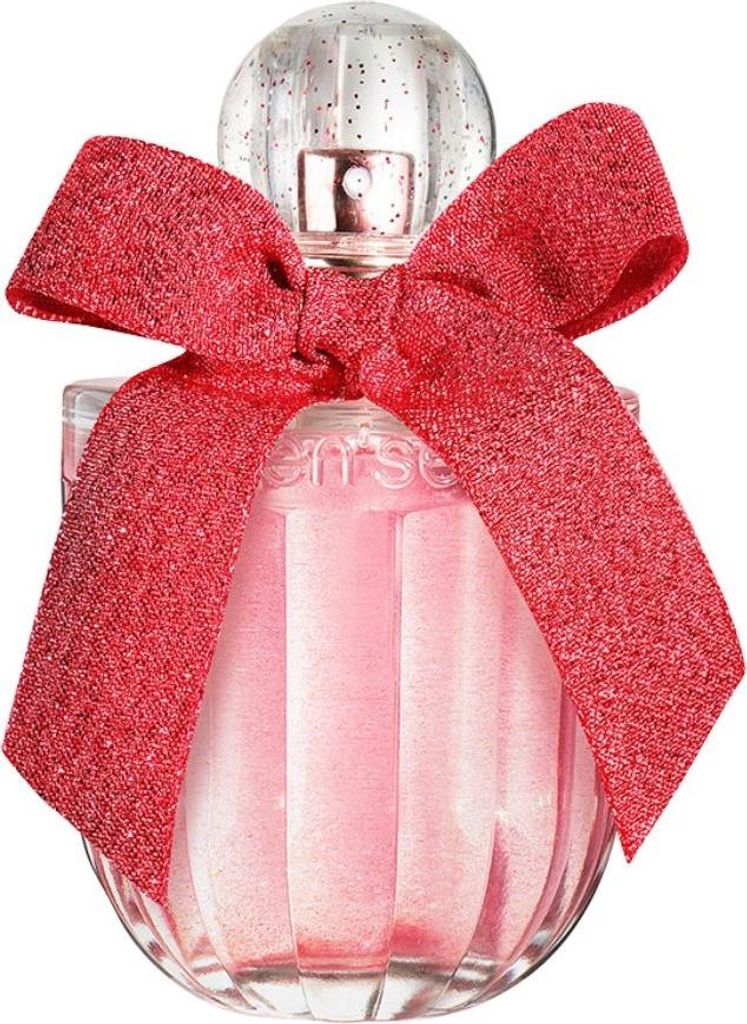 A perfume bottle with a red glitter bow.