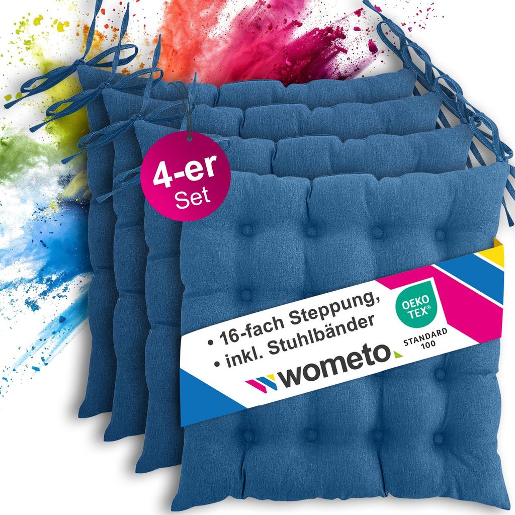 A set of blue seat cushions with a colorful powder explosion in the background.