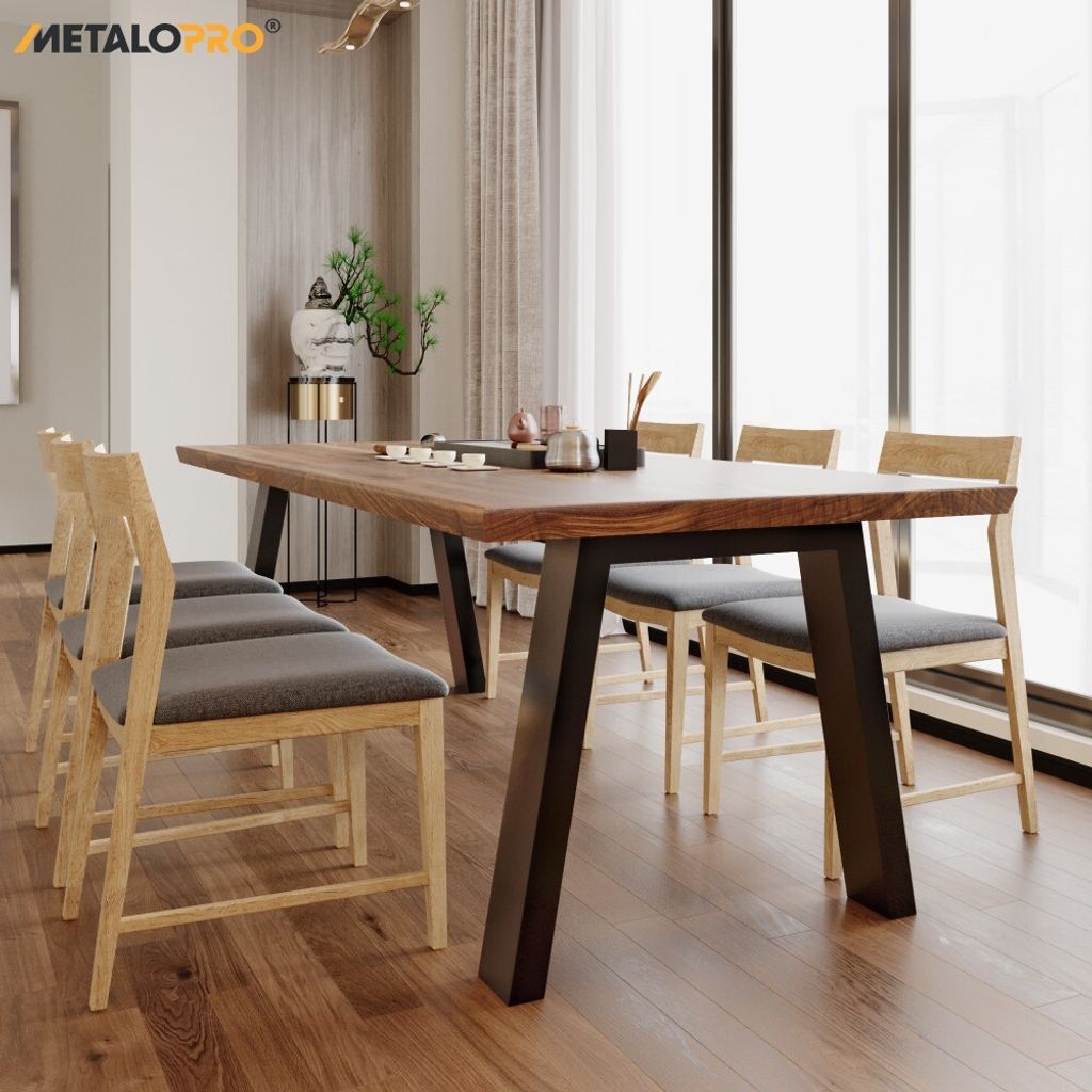A dining table with chairs in a well-lit room.