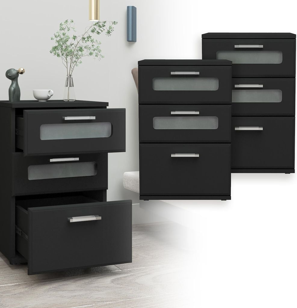A set of black nightstands with frosted glass drawer fronts, displayed in a room setting with a wall and floor.