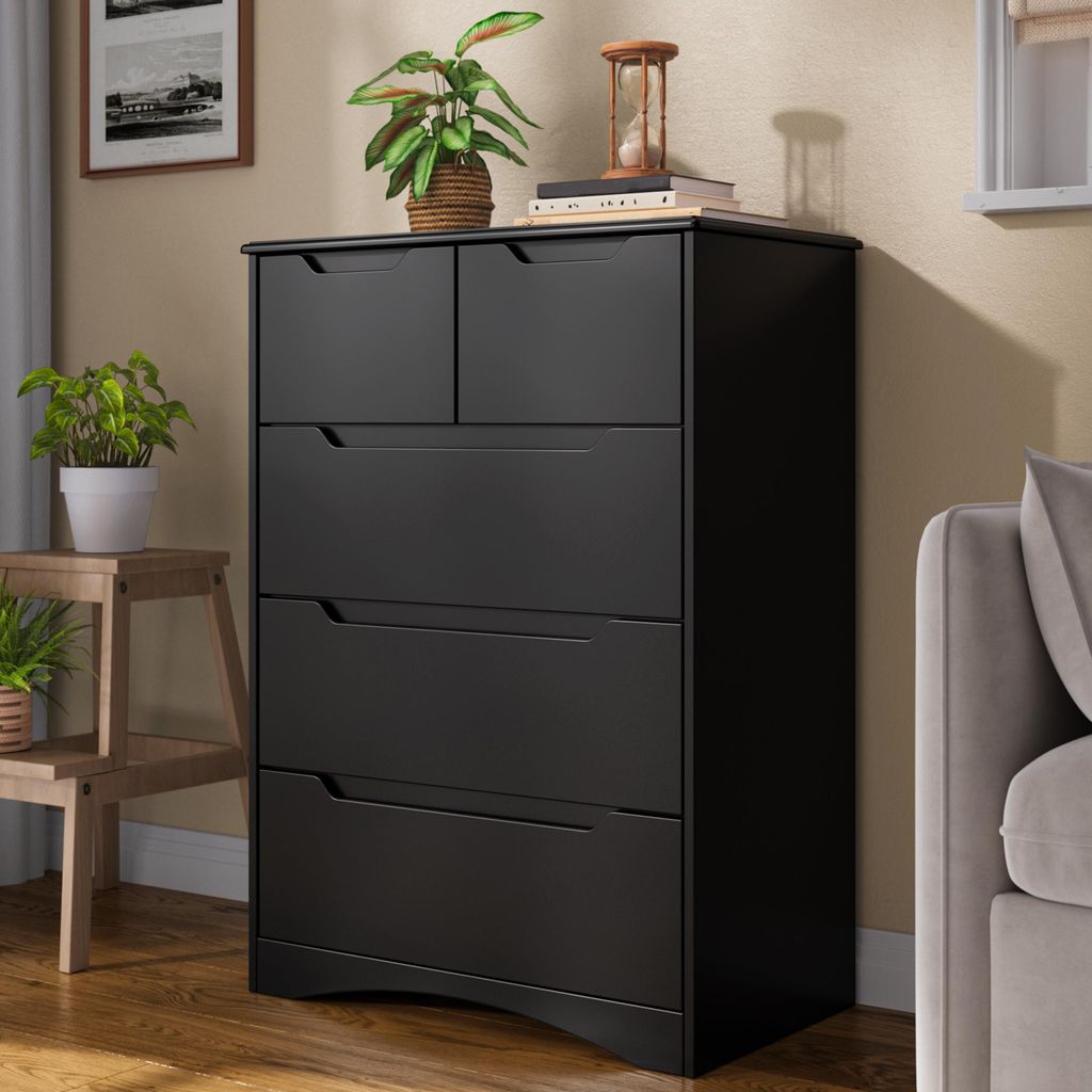 A black dresser with five drawers is shown in a room setting.