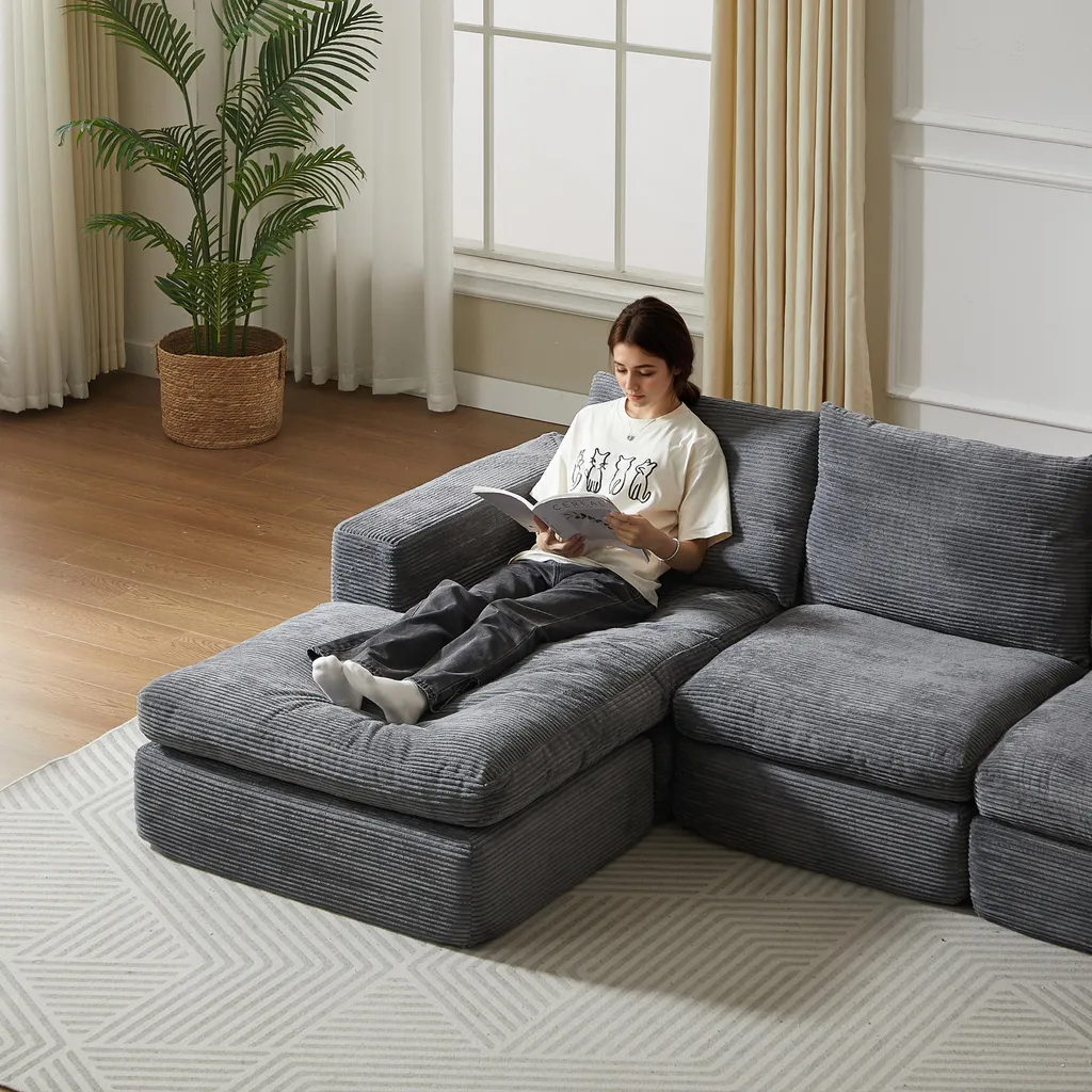 Canapé velours gris foncé structure fer avec coussins d'appui ergonomiques
