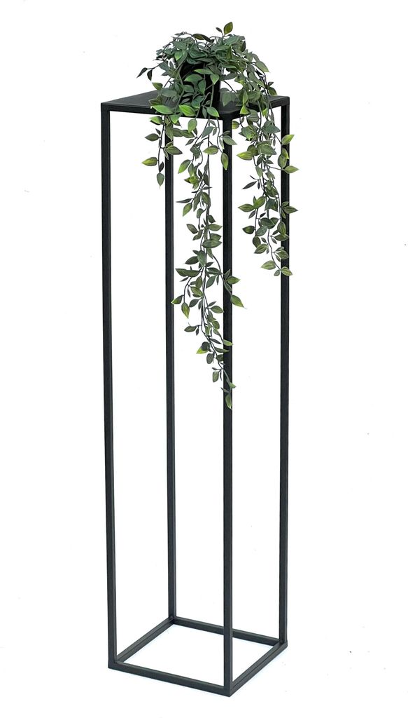 A black metal plant stand with a green plant on top.