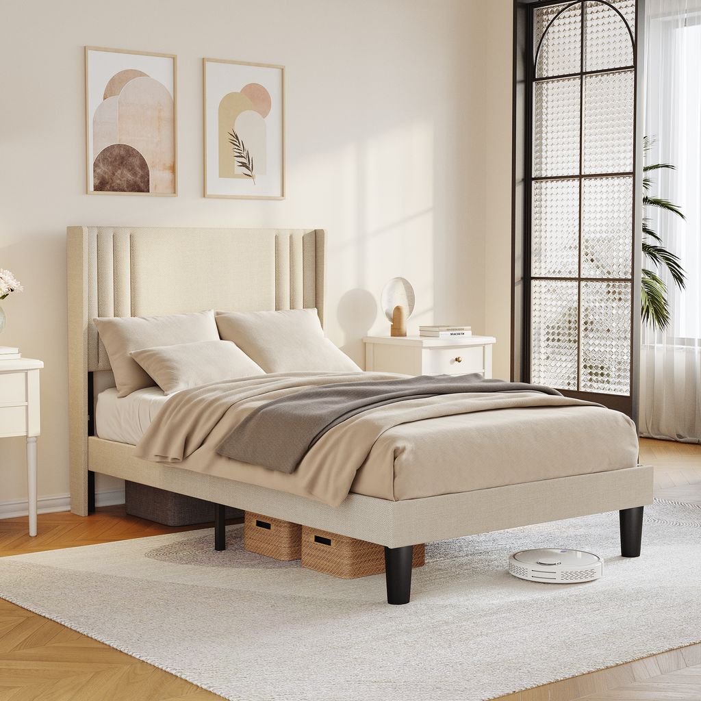 A bedroom scene with a bed, nightstand, and artwork.