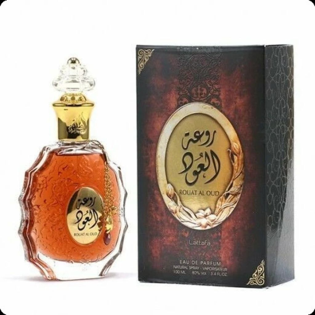 A bottle of Lattafa Rouat Al Oud Eau de Parfum and its packaging are displayed against a white background.