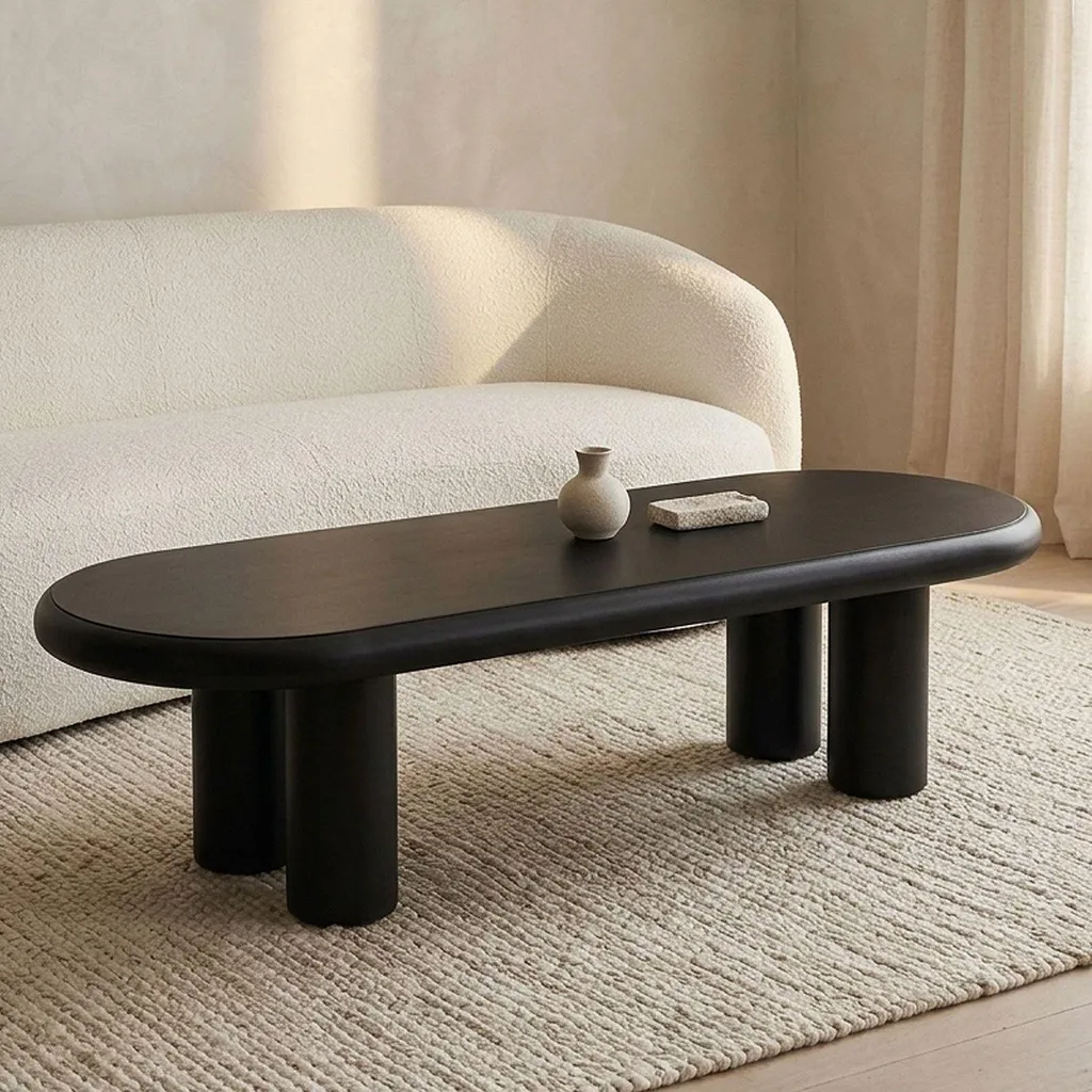 Table basse noire pieds colonnes Roady 160cm forme arrondie de Menzzo