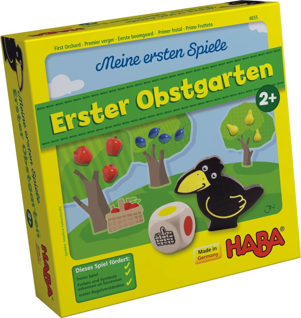 The image shows the front and side of a board game box for "Meine ersten Spiele - Erster Obstgarten". The box features colorful illustrations of fruit trees, apples, pears, blueberries, a crow, and game pieces like a die and a basket.