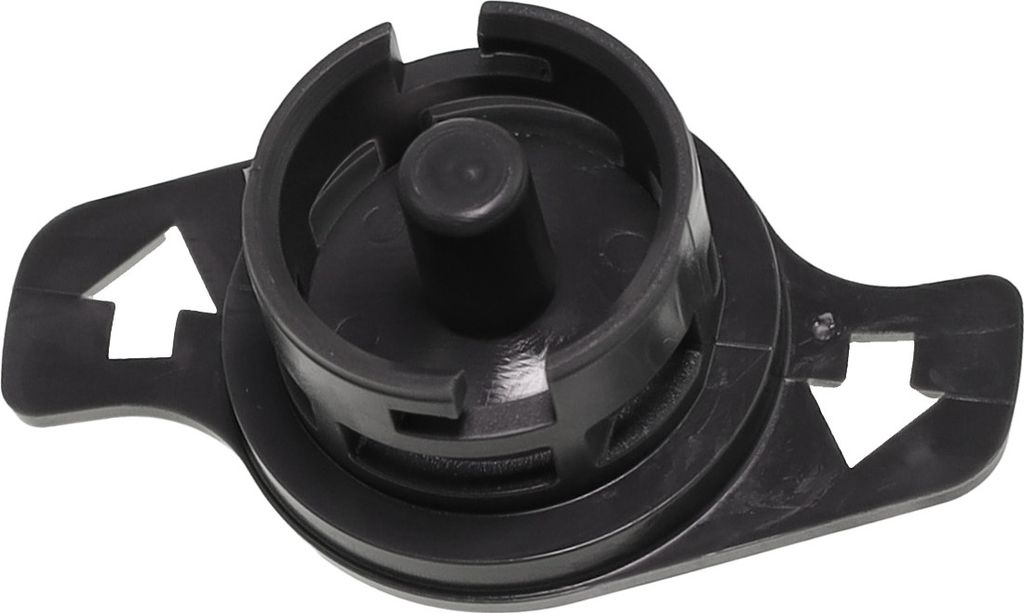 A close-up shot of a black plastic component with a central cylindrical protrusion and two arrow-shaped extensions on the sides.