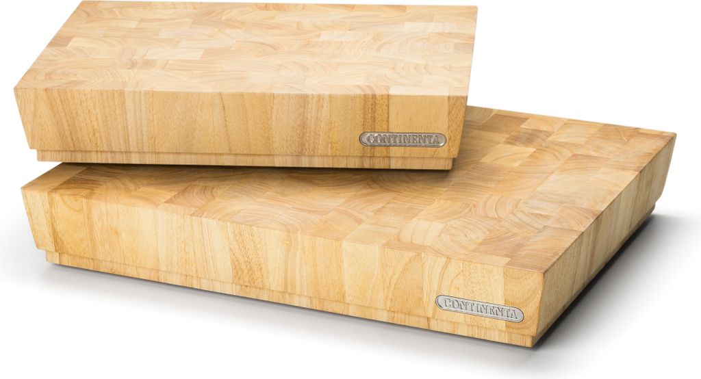 Two wooden cutting boards stacked on a white background.