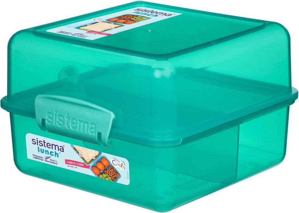 A green Sistema lunch box with compartments.