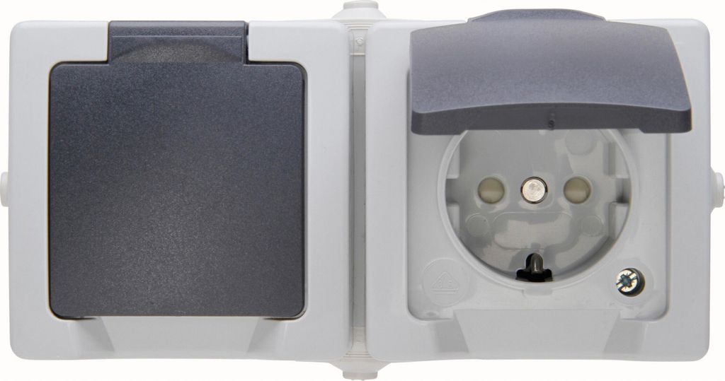 A close-up studio shot of a two-gang electrical outlet with protective covers.