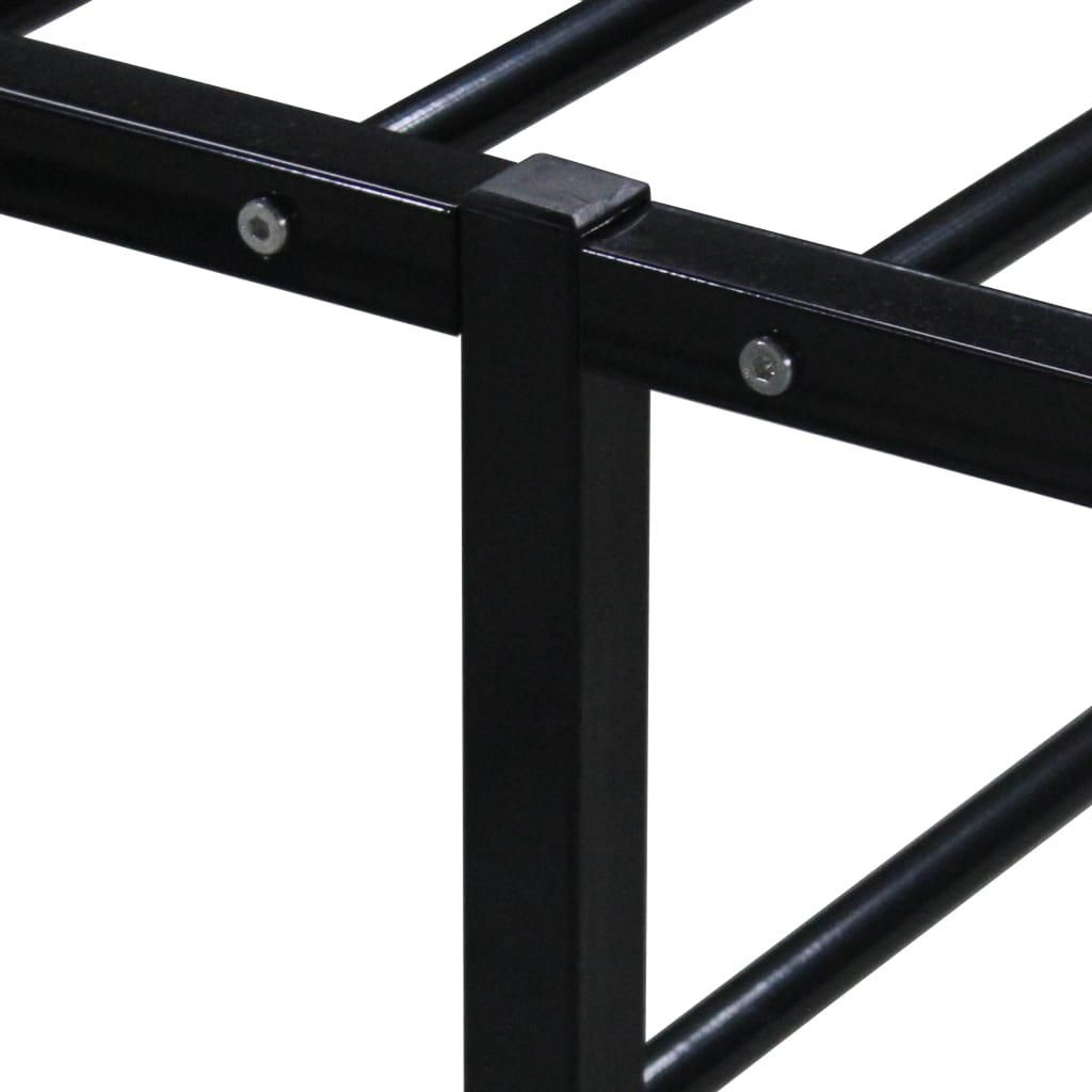 A close-up view of a black metal bed frame.