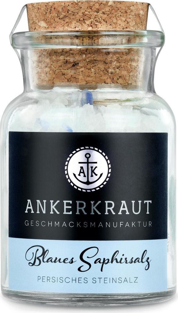 A glass jar of blue salt with a cork stopper and a black label.