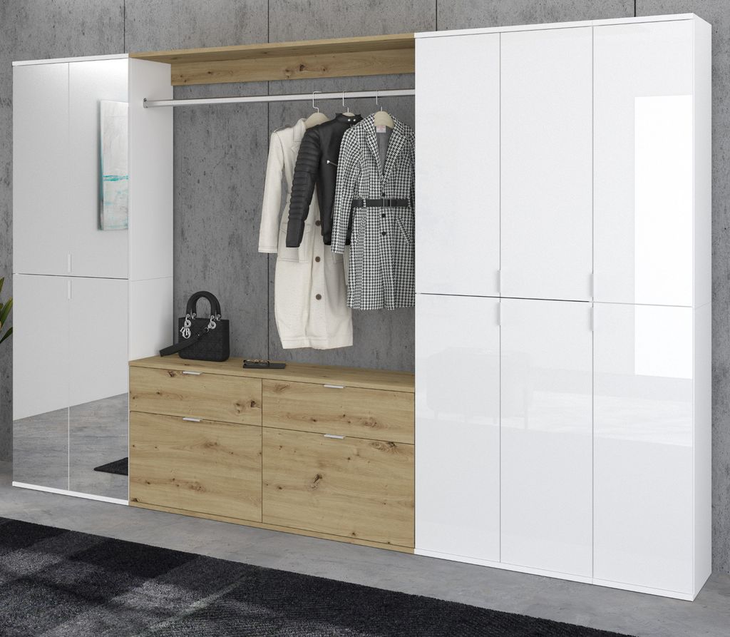 A modern hallway wardrobe with white high-gloss doors and wood-tone drawers and shelf, featuring a hanging rail with coats and a black handbag.