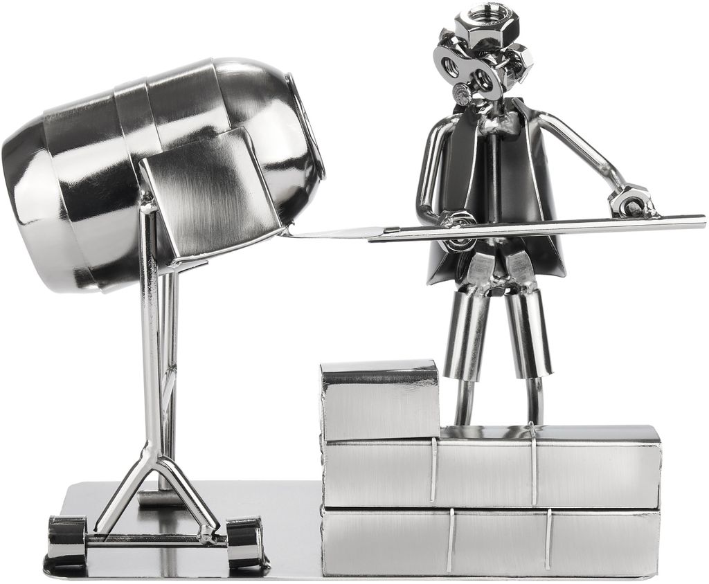 A metal figurine of a construction worker with a cement mixer.