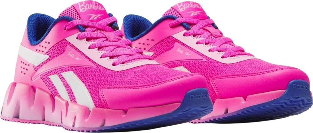 A pair of pink Reebok "X Barbie Zig Dynamica 2" sneakers for children.