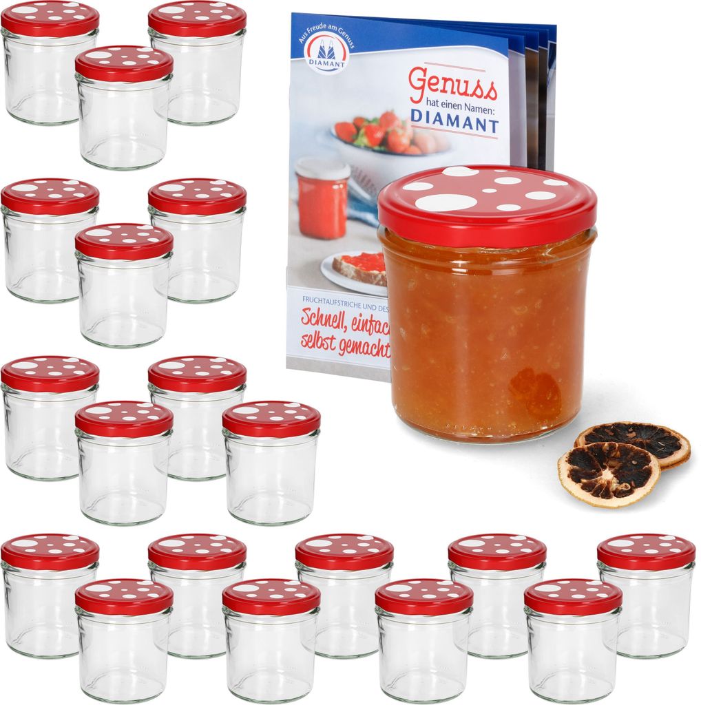 A set of glass jars with red and white polka dot lids, some filled with jam, next to a recipe booklet.