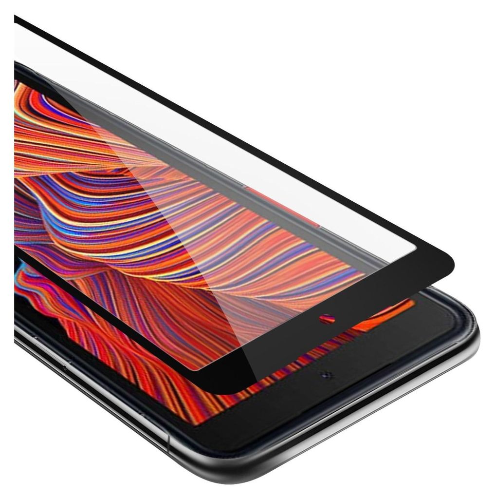 A close-up, angled view of a screen protector being placed on a smartphone.