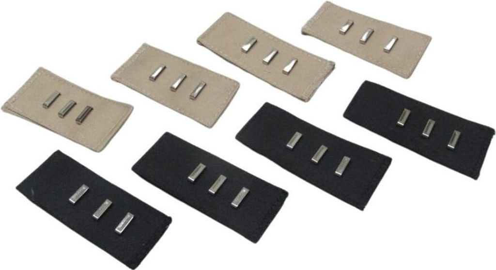 Several fabric extensions with metal pins for adjusting waistband size.