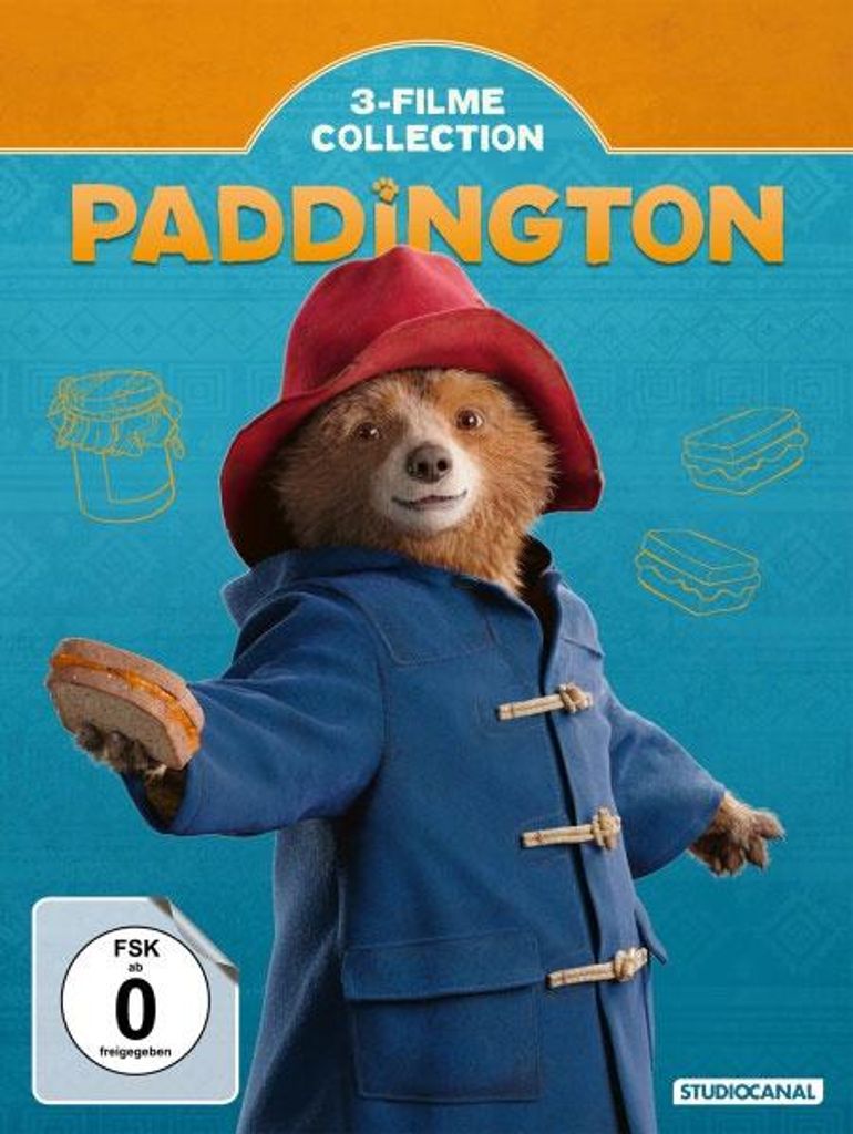Paddington bear in his iconic blue coat and red hat, holding a sandwich.