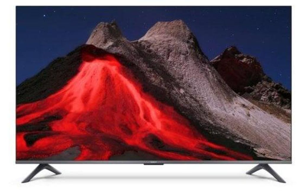 A television displaying an image of a volcano with lava flow.