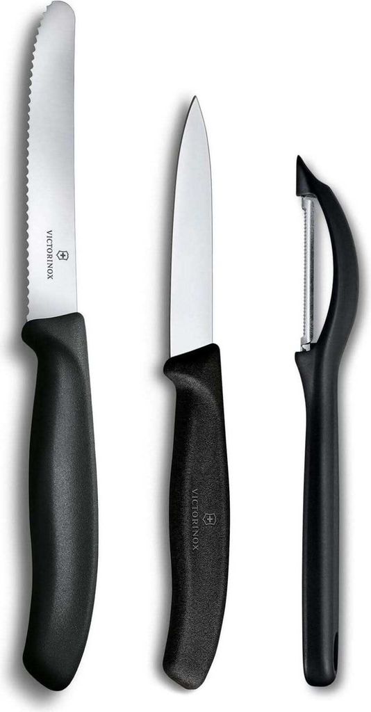 Three kitchen knives and a peeler are displayed against a white background.