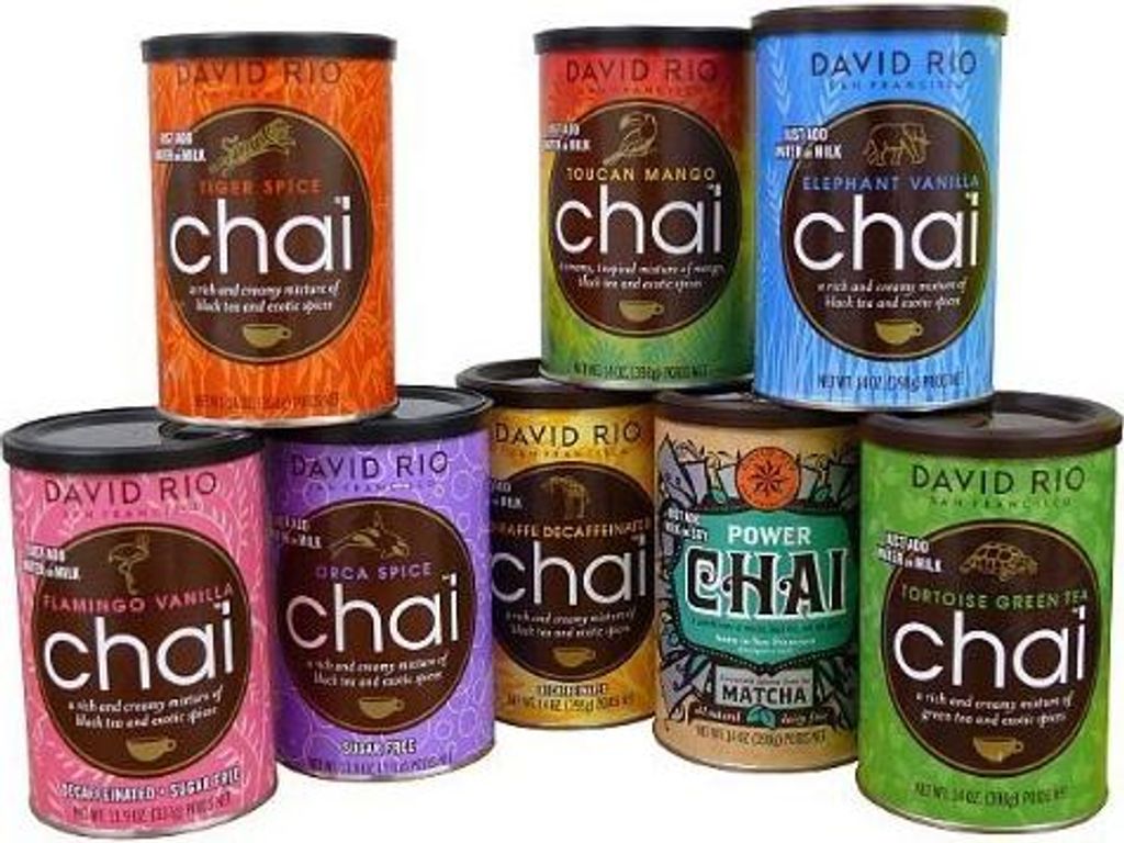 A collection of David Rio chai tea canisters arranged in a pyramid formation on a white background.