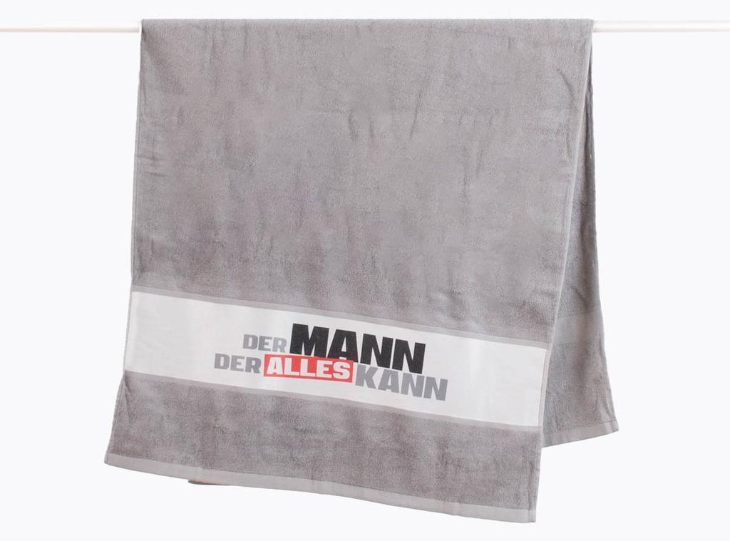 Badetuch Strandtuch "Der Mann der alles kann" 70x140 cm grau