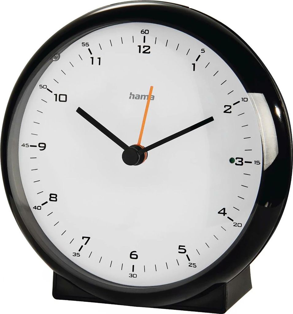 A close-up studio shot of a black alarm clock with a white face and black hands.