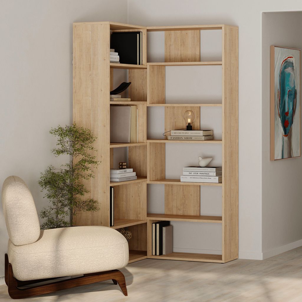 A corner bookshelf unit with books and a decorative lamp.