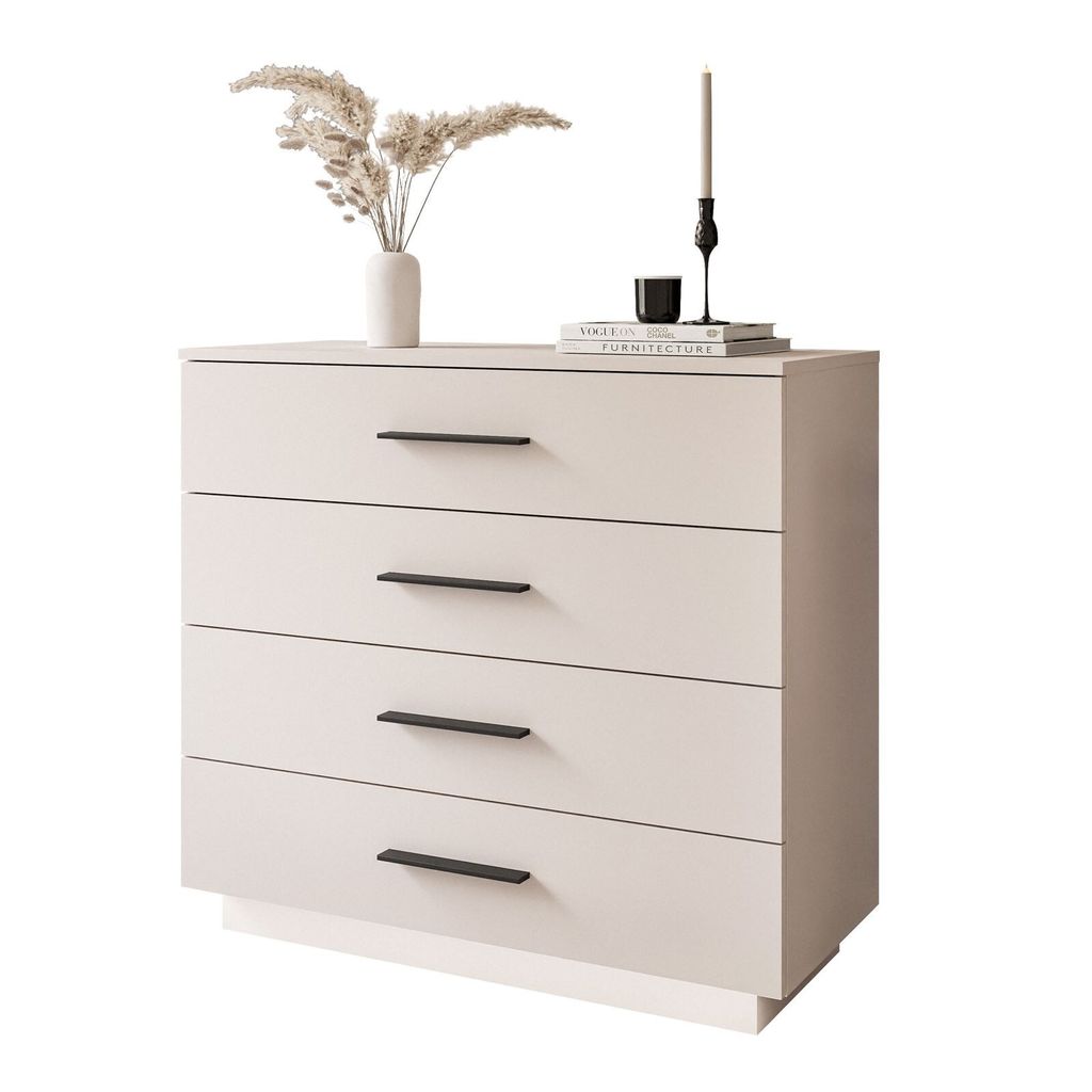 A beige dresser with black handles is shown against a white background. Decorative items are placed on top.