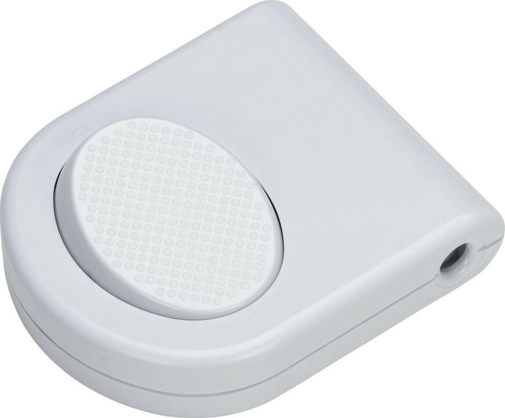 A white foot switch with a textured circular button.