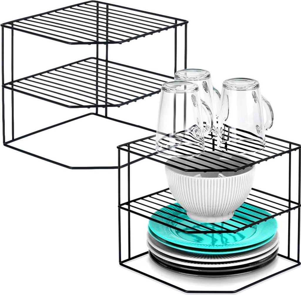 Two black metal corner shelf units are shown against a white background. One unit is empty and has three tiers. The second unit is assembled and holds three glasses, a white bowl, and a stack of teal and white plates.
