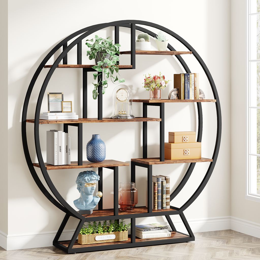 A round, industrial-style bookshelf with multiple shelves displaying various decorative items and books.