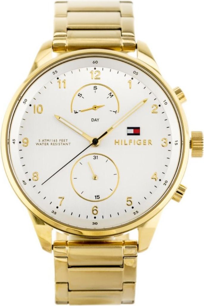 A close-up studio shot of a gold Tommy Hilfiger watch with a white face.