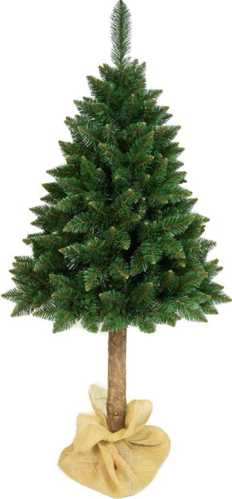 A green artificial Christmas tree with a brown trunk, standing on a beige burlap base, isolated on a white background.
