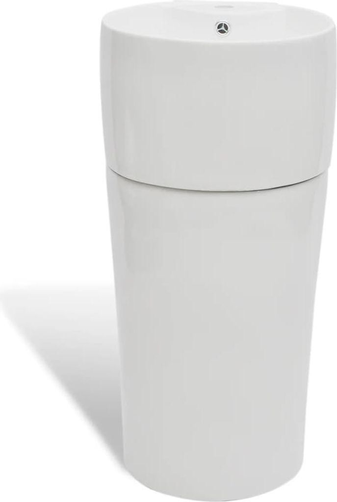 A white ceramic stand washbasin with a faucet and overflow hole, shown from a slightly angled front view against a white background.