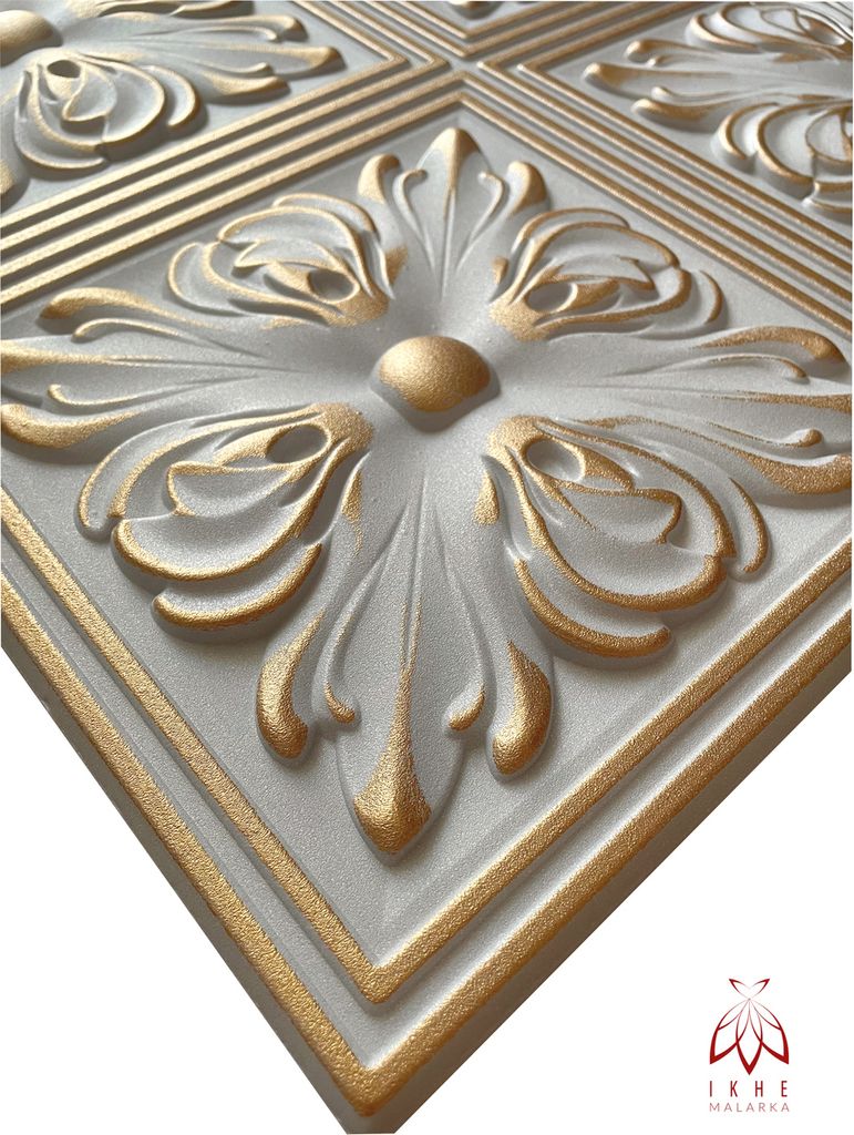 A close-up, angled view of a decorative 3D wall panel with a floral motif, highlighted with gold accents.