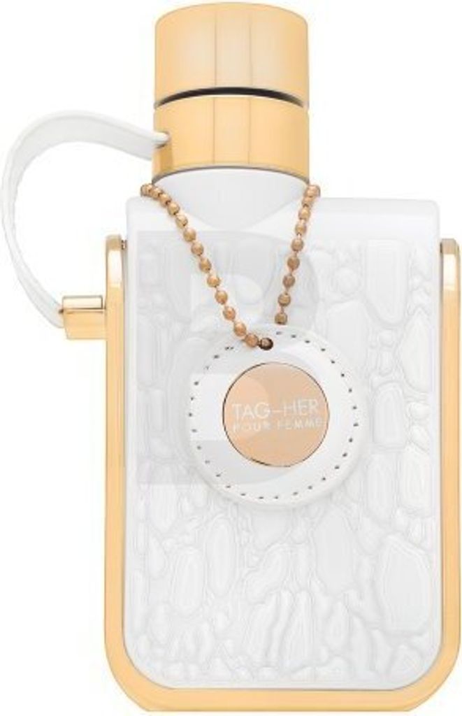 A white perfume bottle with gold accents and a gold chain with a circular tag.