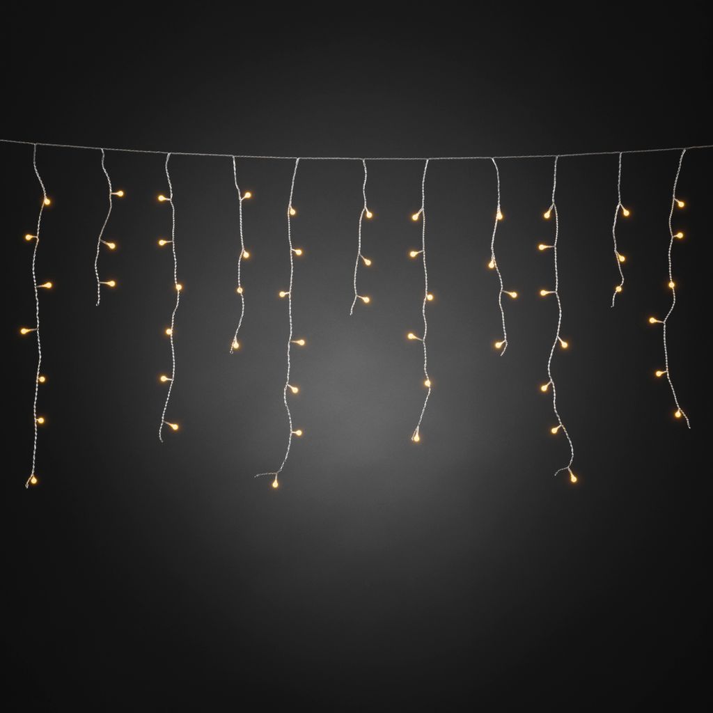 A string of LED icicle lights hanging against a dark background.