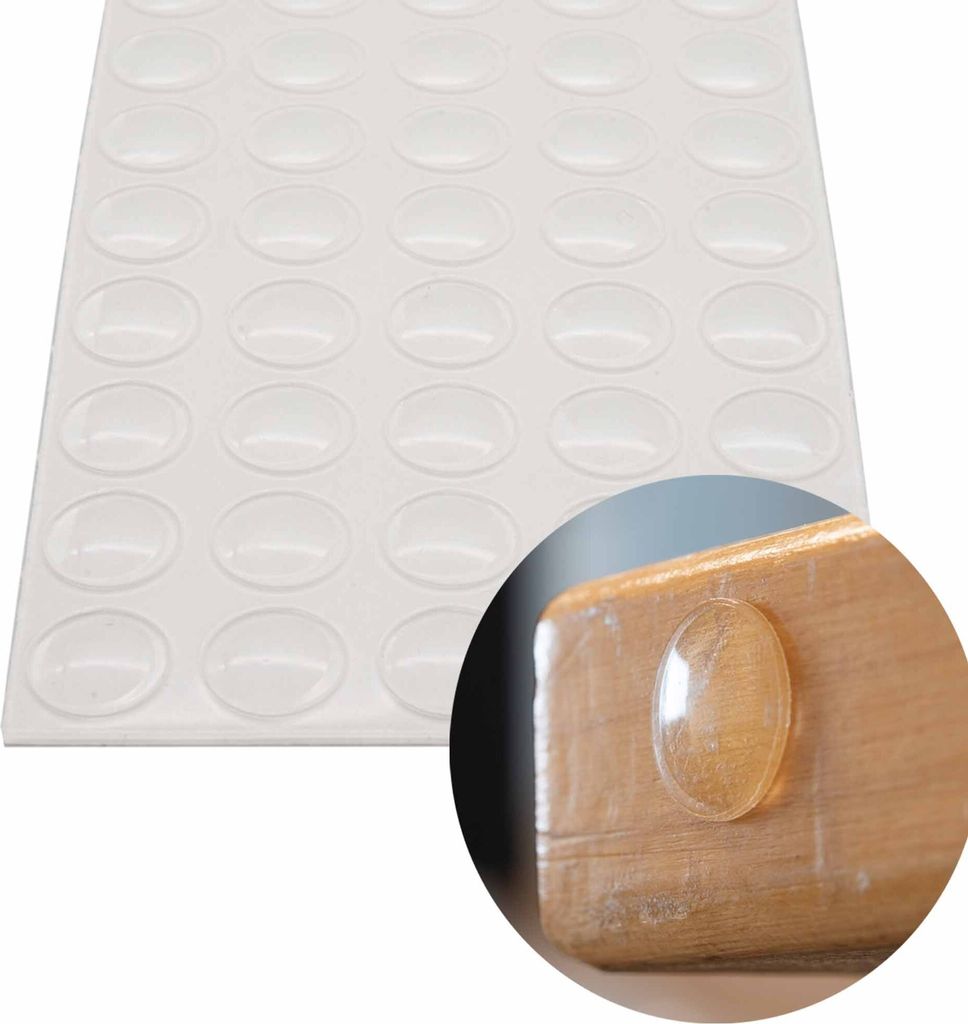 A sheet of clear, oval-shaped adhesive bumper pads is shown along with a close-up of one pad applied to a wooden surface.