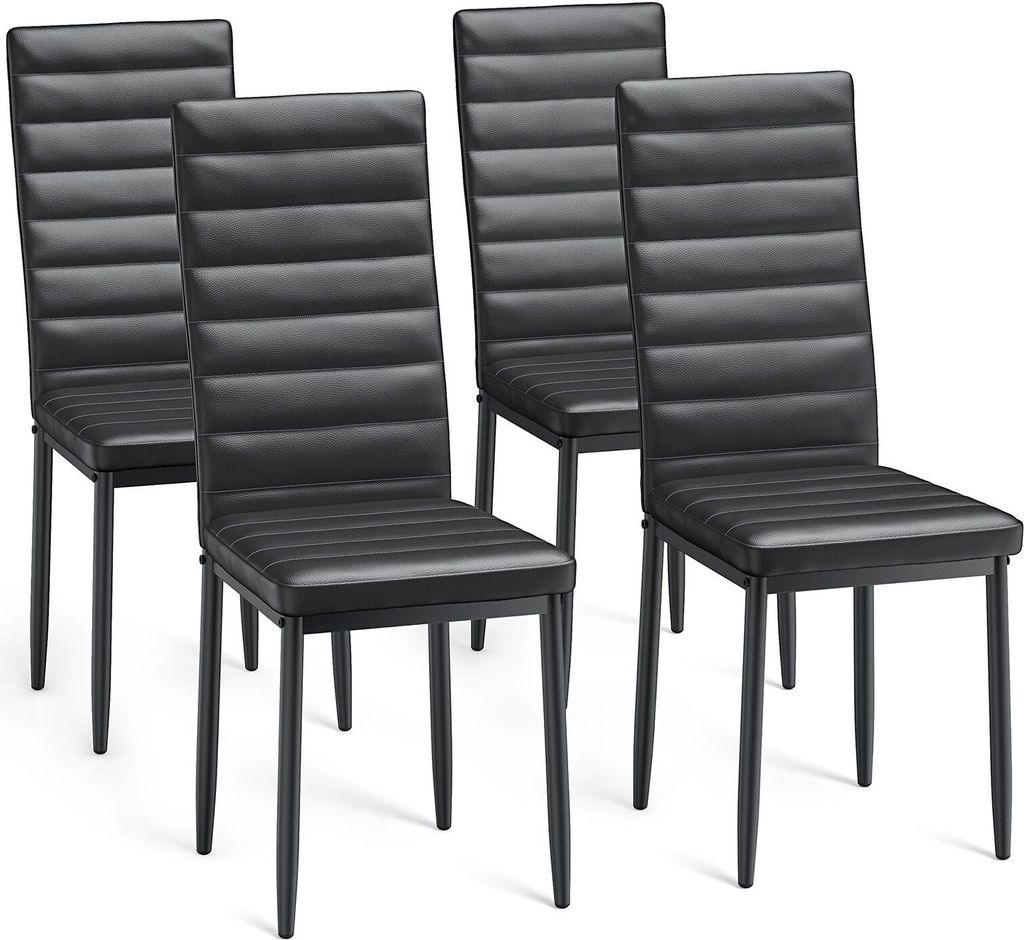 Four black dining chairs are arranged in a studio setting against a white background.