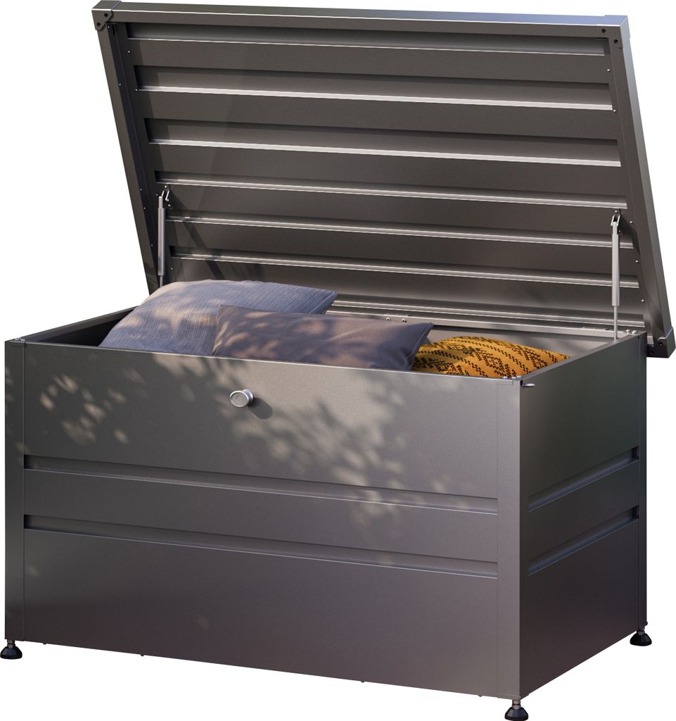 An open metal storage box with pillows inside, placed outdoors.