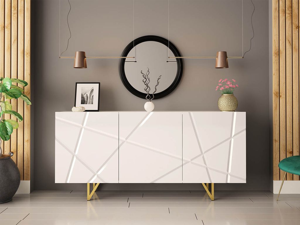 A white sideboard with a geometric pattern and gold legs is displayed in a room with gray walls and wooden accents.
