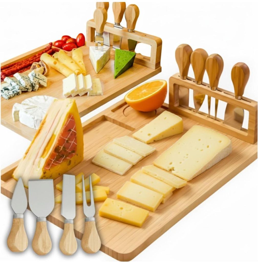 Two cheese boards with various cheeses, meats, and cheese knives.