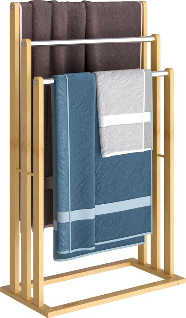A freestanding towel rack made of bamboo with three metal bars, holding folded towels.