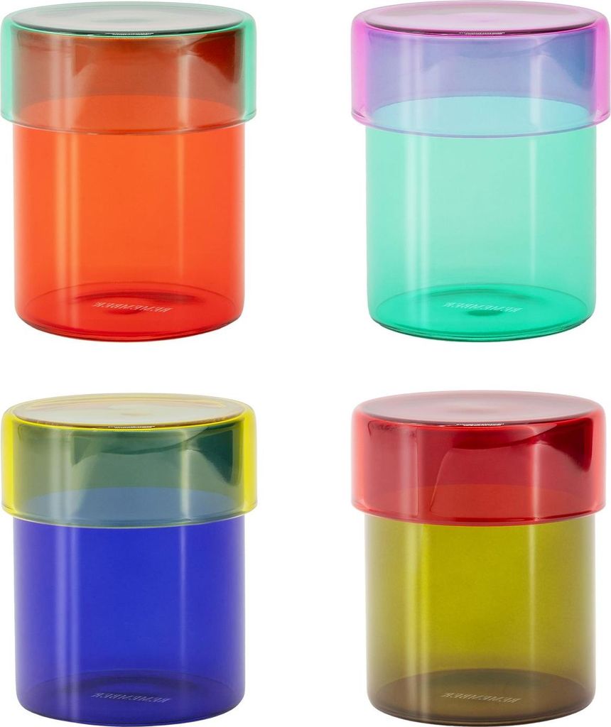 Four colorful glass jars with lids are arranged in a two-by-two grid against a white background.