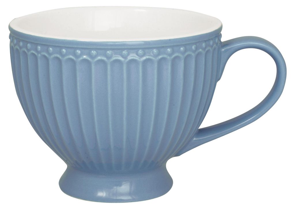 A blue teacup with a white interior is shown against a white background.