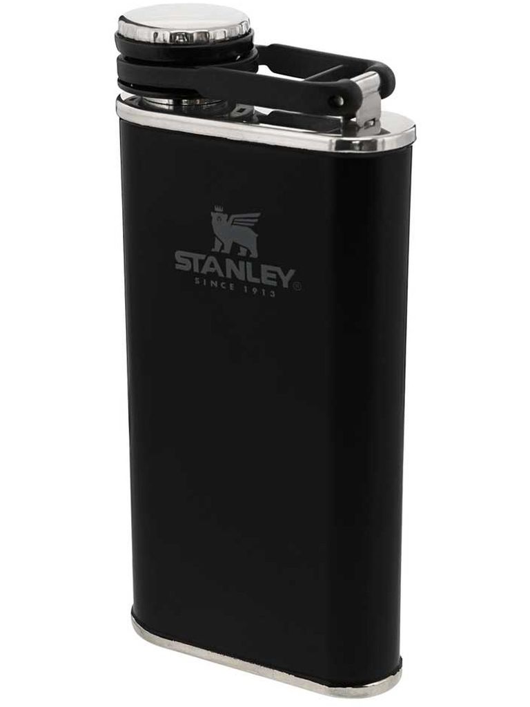 A black Stanley flask with a silver cap and silver trim at the bottom.